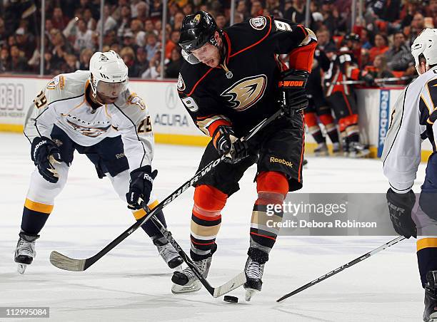 Bobby Ryan of the Anaheim Ducks battles for the puck against Joel Ward of the Nashville Predators in Game Five of the Western Conference...