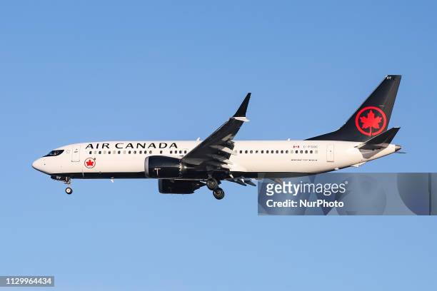 Air Canada Boeing 737 MAX 8 landing at London Heathrow International Airport LHR EGLL with nice blue sky weather. The Boeing 737 MAX8 aircraft has 2X...