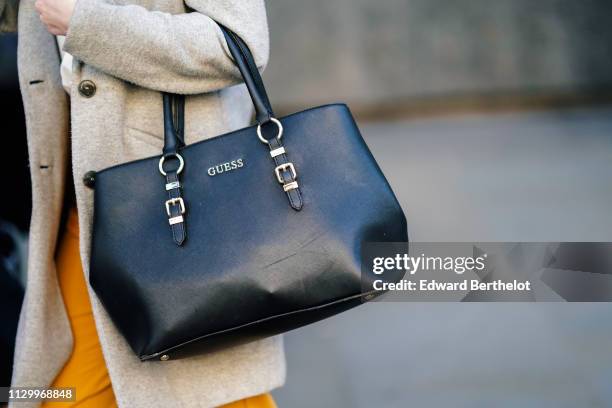 Guess bag is seen, during London Fashion Week February 2019 on February 15, 2019 in London, England.