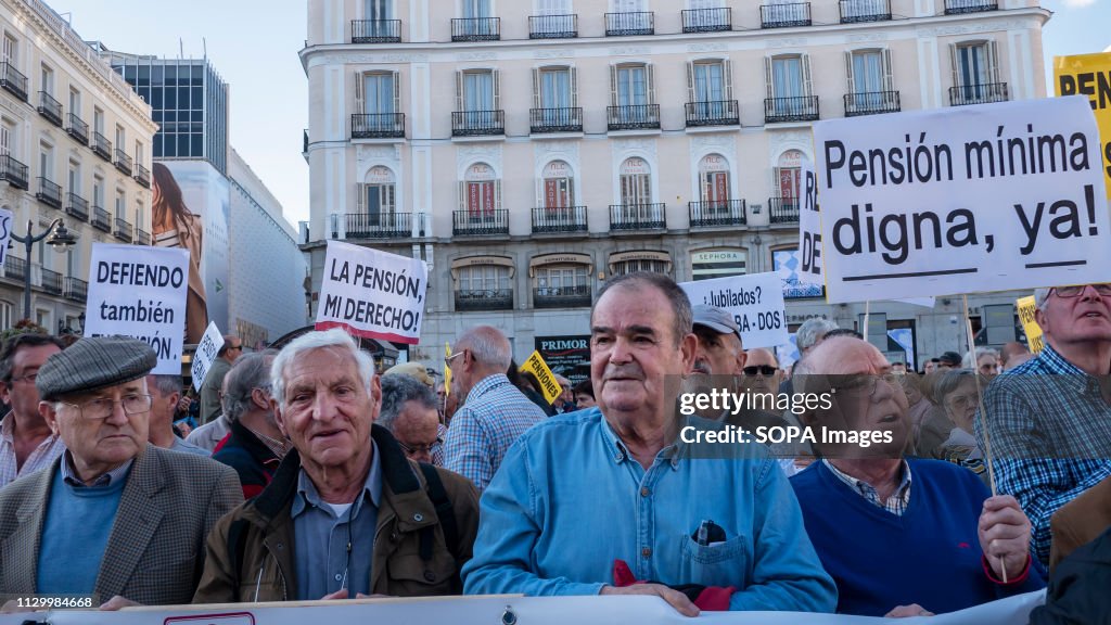 A protester seen holding a placard saying the pension is my...