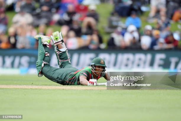 Mohammad Saifuddin of Bangladesh dives to save his wicket during Game 2 of the One Day International series between New Zealand and Bangladesh at...