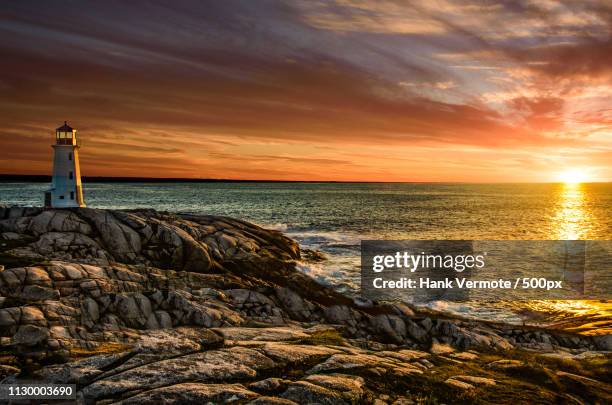 lighthouse sunset - peggys cove stock-fotos und bilder