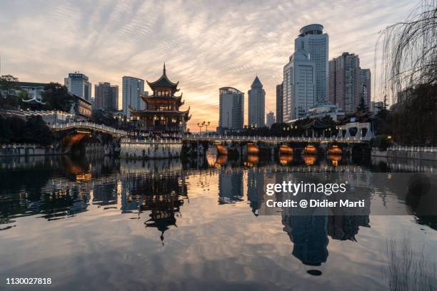 sunset over guiyang downtown district in guizhou province, china - guiyang imagens e fotografias de stock