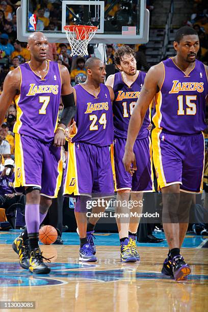 Pau Gasol, Kobe Bryant, Lamar Odom and Ron Artest of the Los Angeles Lakers walk back to the bench in Game Three of the Western Conference...