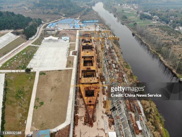 Aerial view of life-size Titanic replica under construction on a bank of Qijiang River at Daying County on February 14, 2019 in Suining, Sichuan...
