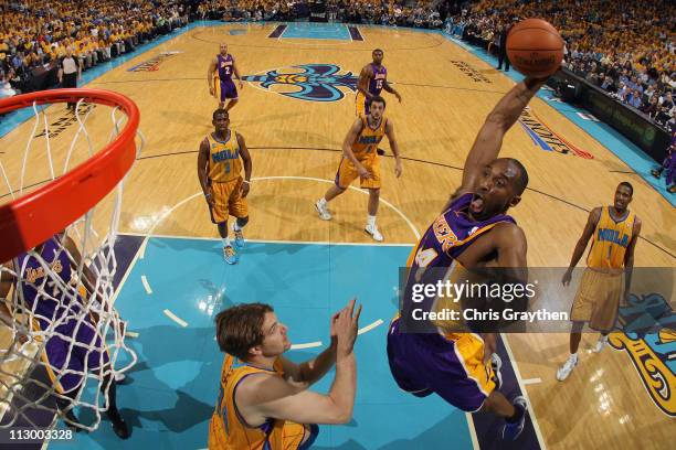 Kobe Bryant of the Los Angeles Lakers dunks the ball over Aaron Gray of the New Orleans Hornets in Game Three of the Western Conference Quarterfinals...