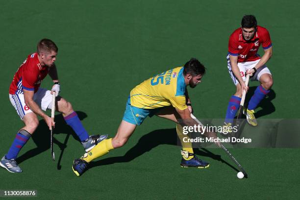 Trent Mitton of Australia controls the ball Henry Weir of Great Britain during the Men's FIH Field Hockey Pro League match between Australia and...