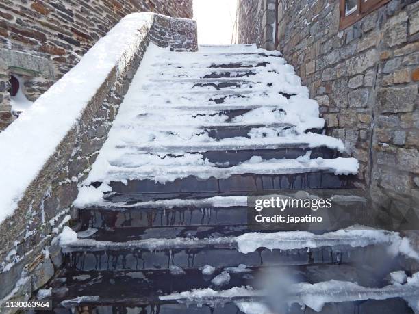 snow covered stairs and a mountain village - escalones stock pictures, royalty-free photos & images