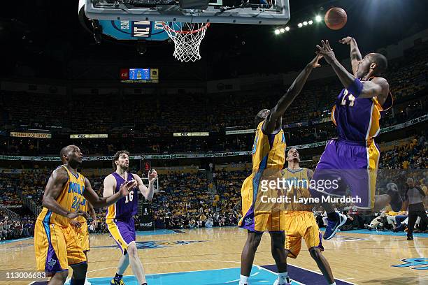 Kobe Bryant of the Los Angeles Lakers shoots against Emeka Okafor of the New Orleans Hornets in Game Three of the Western Conference Quarterfinals in...