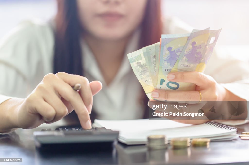 Woman counting money Euro banknotes, Business or stock market concept image.
