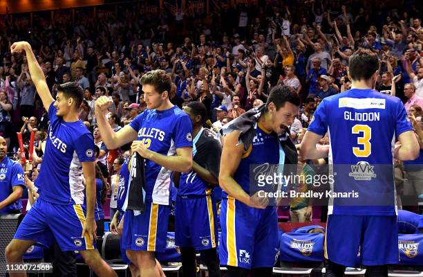 Jason Cadee of the Bullets and team mates celebrate victory during the round 18 NBL match between the Brisbane Bullets and the New Zealand Breakers...