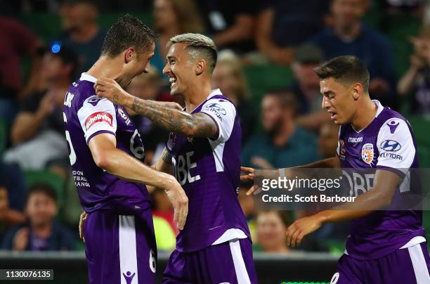 Jason Davidson of the Glory celebrates with Chris Ikonomidis and Dino Djulbic after scoring the first goal during the round 19 A-League match between...