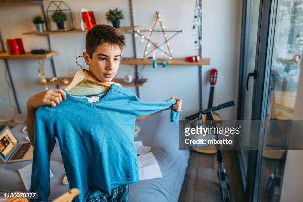 he wearing favorite sweater - boy clothes stock pictures, royalty-free photos & images