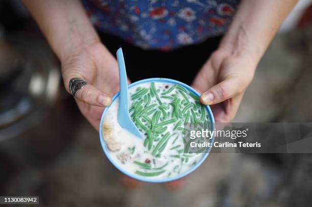 hands holding a bowl of ice chendol - penang stock pictures, royalty-free photos & images