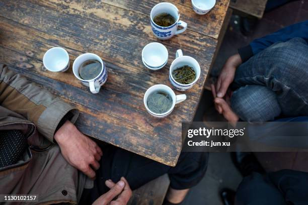 playing cards and drinking tea in a teahouse - yunnan province stock pictures, royalty-free photos & images