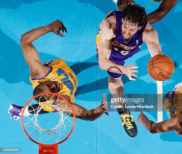 Pau Gasol of the Los Angeles Lakers shoots against D.J. Mbenga of the New Orleans Hornets in Game Three of the Western Conference Quarterfinals in...