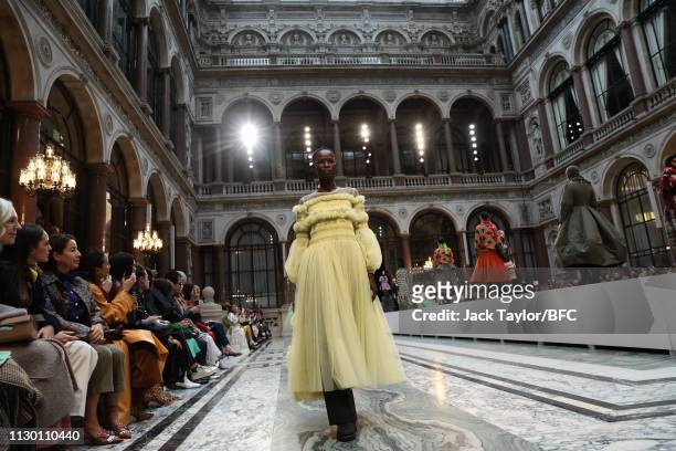 Models walk the runway during the finale of the Molly Goddard show during London Fashion Week February 2019 at the Durbar Court, Foreign and...