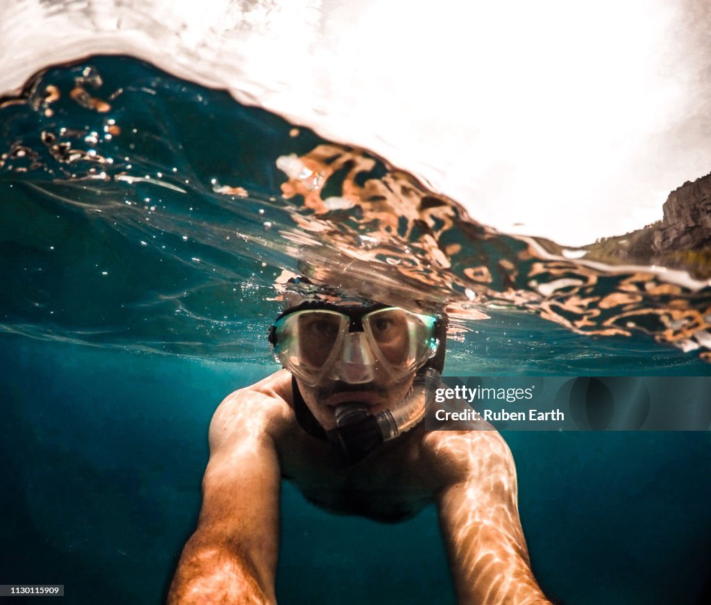 Man taking a selfie while snorkelling