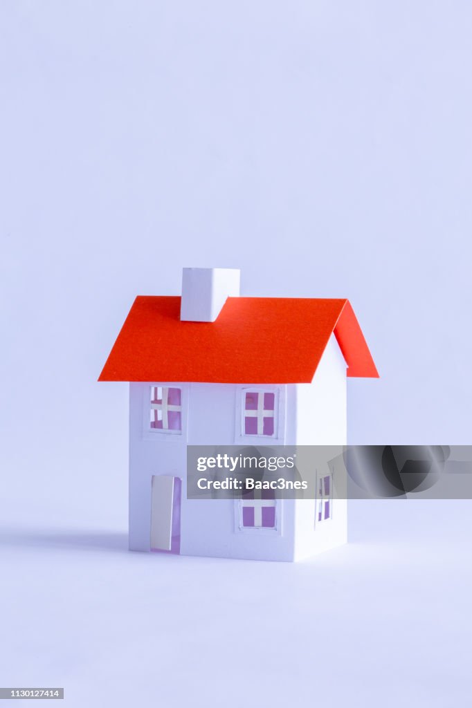 Paper house on white background