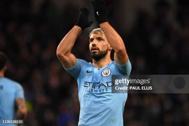 Manchester City's Argentinian striker Sergio Aguero celebrates after scoring the opening goal from the penalty spot during the UEFA Champions League...