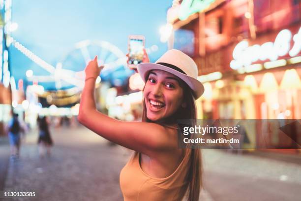 happy girl at the amusement park - generation z selfie stock pictures, royalty-free photos & images