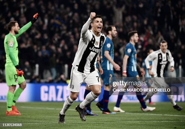 Juventus' Portuguese forward Cristiano Ronaldo celebrates after scoring 2-0 during the UEFA Champions League round of 16 second-leg football match...