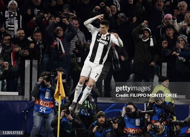 Juventus' Portuguese forward Cristiano Ronaldo celebrates after scoring 3-0 during the UEFA Champions League round of 16 second-leg football match...