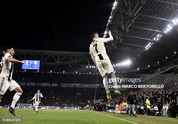 Juventus' Portuguese forward Cristiano Ronaldo celebrates after scoring 3-0 during the UEFA Champions League round of 16 second-leg football match...