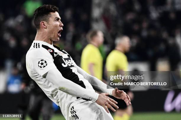 Juventus' Portuguese forward Cristiano Ronaldo celebrates after scoring 3-0 during the UEFA Champions League round of 16 second-leg football match...