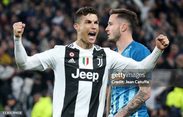 Cristiano Ronaldo of Juventus celebrates the victory at final whistle while Saul Niguez of Atletico Madrid is dejected following the UEFA Champions...