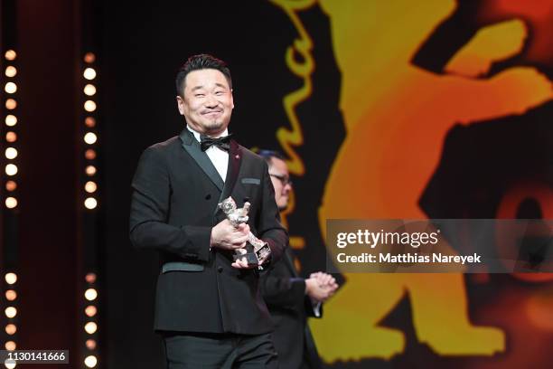 Wang Jingchun, winner of the Silver Bear for Best Actor for "So long, My Son" is s on stage at the closing ceremony of the 69th Berlinale...