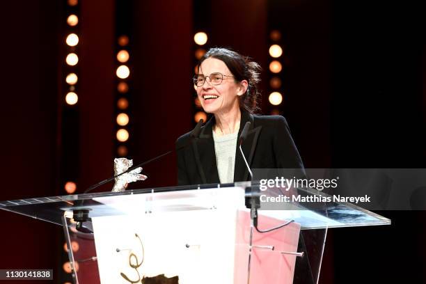 Angela Schanelec, winner of the Silver Bear for Best Director for "I Was at Home, But", speaks on stage at the closing ceremony of the 69th Berlinale...