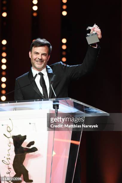Francois Ozon, winner of the Silver Bear Grand Jury Prize for "By the Grace of God" is seen on stage at the closing ceremony of the 69th Berlinale...