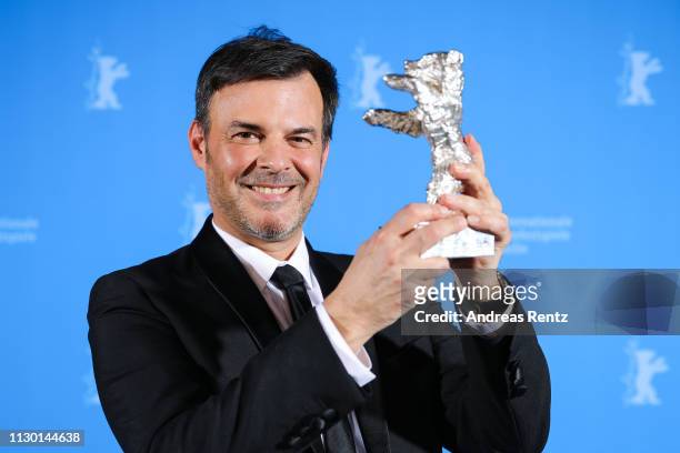 Francois Ozon, winner of the Silver Bear Grand Jury Prize for "By the Grace of God", poses backstage at the closing ceremony of the 69th Berlinale...