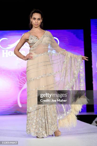 Models walk the runway for Aarti Mahtani at the House of iKons show during London Fashion Week February 2019 at the Millennium Gloucester London...