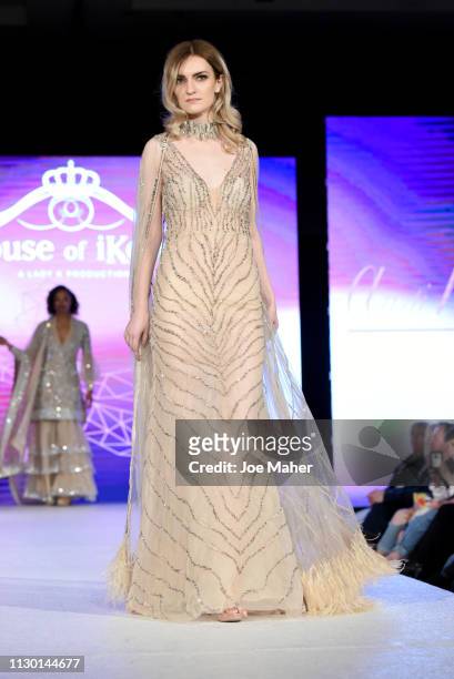 Models walk the runway for Aarti Mahtani at the House of iKons show during London Fashion Week February 2019 at the Millennium Gloucester London...