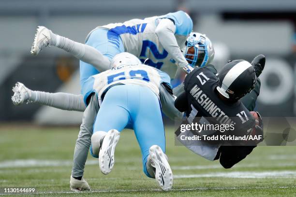 Damian Washington of the Birmingham Iron is brought down Will Davis and Trevor Reilly of Salt Lake Stallions during an Alliance of American Football...