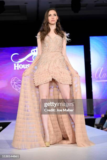 Models walk the runway for Aarti Mahtani at the House of iKons show during London Fashion Week February 2019 at the Millennium Gloucester London...