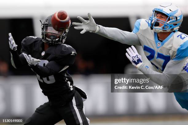 Micah Hannemann of Salt Lake Stallions defends a pass intended for DeVozea Felton of Birmingham Iron during an Alliance of American Football game at...