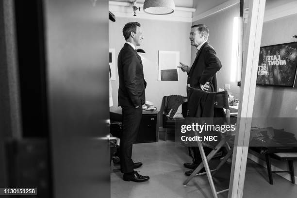 Episode 810 -- Pictured: Host Seth Meyers talks to Governor John Hickenlooper backstage on March 12, 2019 --