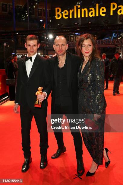 Nadav Lapid , winner of the Golden Bear for Best Film for "Synonymes" poses at the red carpet with Tom Mercier and Louise Chevillotte after the...
