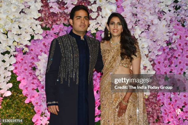 Akash Ambani and Shloka Mehta pose for a photograph at Akash Ambani & Shloka Mehta wedding party, in Mumbai.