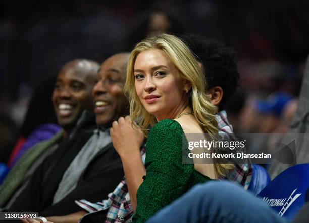 Record producer Alex da Kid and a guest attend the Portland Trail Blazers and Los Angeles Clippers basketball game at Staples Center on March 12,...