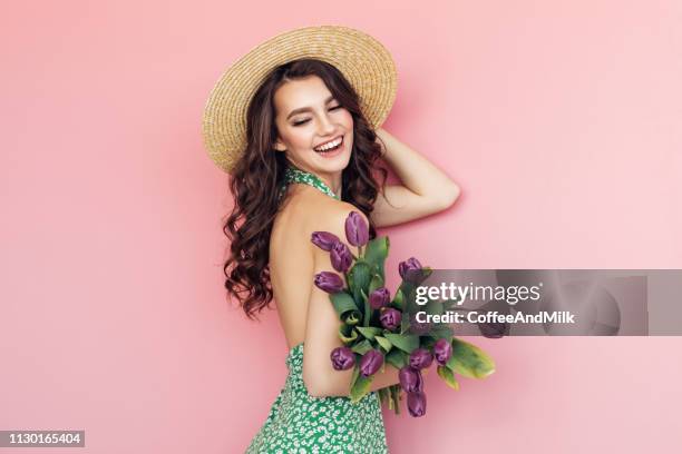 lovely woman with tulips bunch - summer frock stock pictures, royalty-free photos & images