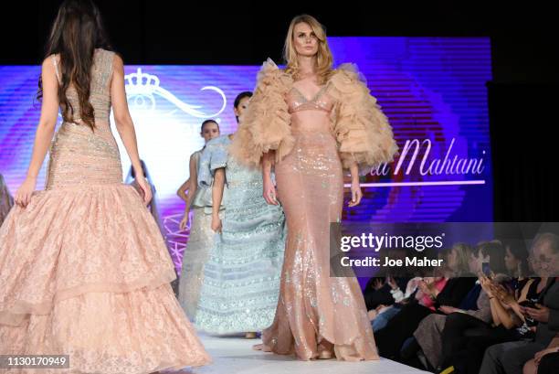 Models walk the runway for Aarti Mahtani at the House of iKons show during London Fashion Week February 2019 at the Millennium Gloucester London...