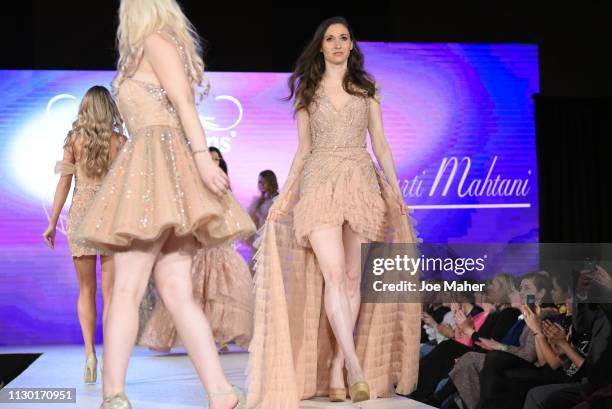 Models walk the runway for Aarti Mahtani at the House of iKons show during London Fashion Week February 2019 at the Millennium Gloucester London...