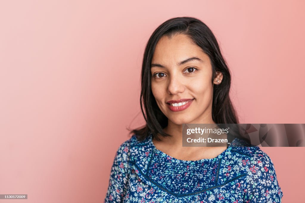 Portrait of beautiful smiling Mexican millennial woman