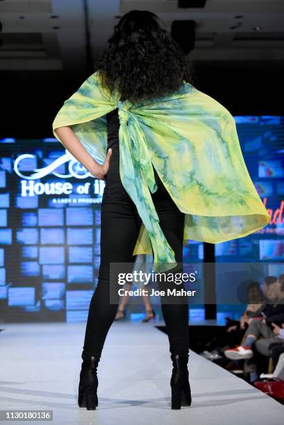 Models walk the runway for Nadia Azumi at the House of iKons show during London Fashion Week February 2019 at the Millennium Gloucester London Hotel...