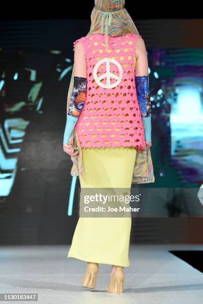 Models, detail, walk the runway for American Umma at the House of iKons show during London Fashion Week February 2019 at the Millennium Gloucester...