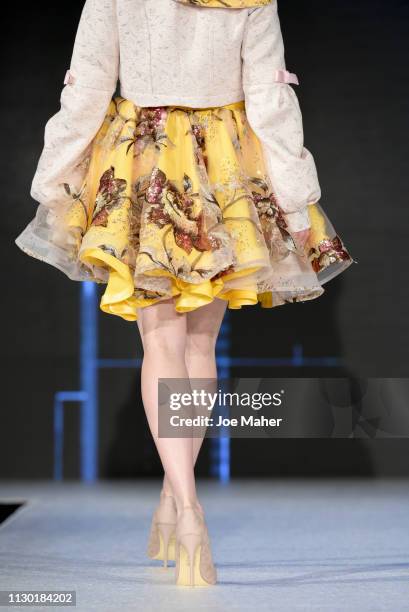 Models, skirt detail, walk the runway for Ana De Sa at the House of iKons show during London Fashion Week February 2019 at the Millennium Gloucester...